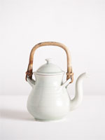 teapot with celadon glaze and cane handle