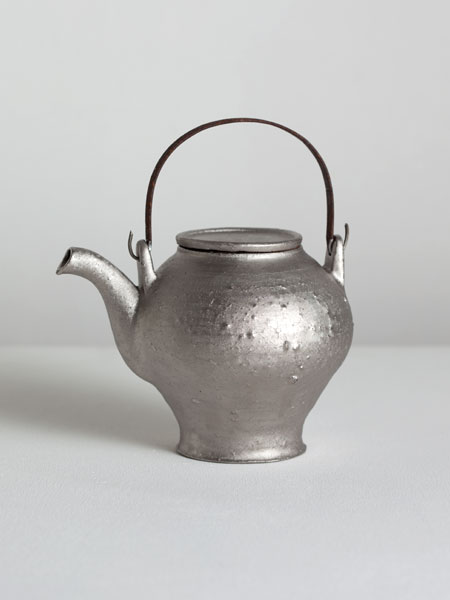 platinum teapot with iron handle